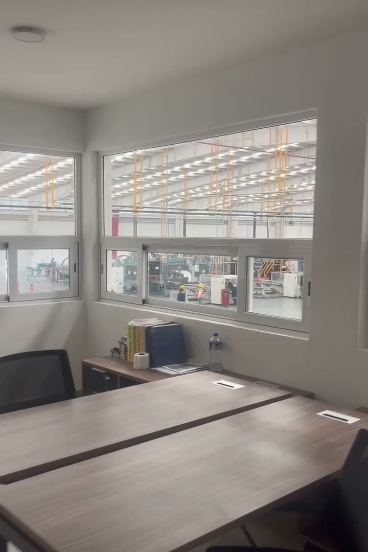 Reyma Planta — Oficinas · ventanales a producción